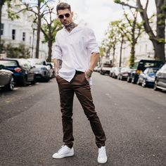 "Looking for the perfect trousers to take your style up a notch? Our slim fit chinos are just what you need. Made from brown twill fabric, they have a slim fit that's stretched for comfort and a dapper look. Plus, the button and zip fly fastening make them ideal for both business and casual looks. And with five pockets, you'll have plenty of room to carry all your essentials. If you're looking to create a dapper look, pair these brown slim fit chinos trousers with long shirts. Brown twill fabric Slim fit Button and zip fly fastening 5-pocket design Fabric: 98% Cotton, 2% Elastane Model is 6'1\" and Wears Size 32 FIND YOUR SIZE and check our size guide to find your perfect fit. Size = 30 - 40 Waist = 80cm - 104cm Hip = 100cm - 124cm Inside Leg = 81cm Waist is measured All Around. Hip is mea Casual Brown Slim Fit Dress Pants, Brown Tapered Leg Chinos For Work, Brown Tapered Leg Chinos For Business Casual, Brown Cotton Chinos For Workwear, Casual Brown Cotton Dress Pants, Casual Brown Chino Cotton Twill Chinos, Brown Casual Chinos For Business Casual, Business Casual Brown Cotton Dress Pants, Brown Relaxed Fit Straight Chinos