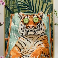 a tiger with cucumbers on its eyes sitting in a chair next to flowers