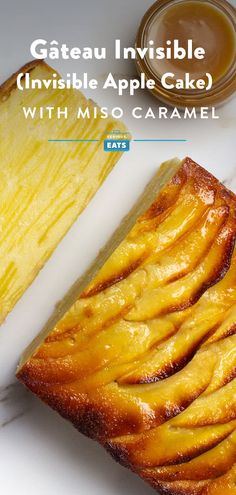 a piece of cake sitting on top of a white plate next to a pineapple