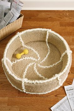 a dog bed made out of jute and yarn