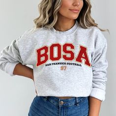 Perfect sweatshirt for Nick Bosa and San Francisco football fans this season! Ideal for any situation, a unisex heavy blend crewneck sweatshirt is pure comfort. These garments are made from polyester and cotton. This combination helps designs come out looking fresh and beautiful. The collar is ribbed knit, so it retains its shape even after washing. There are no itchy side seams on these sweaters.  .: 50% cotton, 50% polyester .: Medium-heavy fabric (8.0 oz/yd² (271.25 g/m .: Loose fit .: Sewn-in label .: Runs true to size CARE INSTRUCTIONS: -Please wash all clothing items INSIDE OUT to preserve the design. -Please wash all clothing items on cold, and dry on Medium- low heat. -DO NOT IRON. -DO NOT TIE DYE. **Please check our color and size charts before you place your order. If you have an Fleece Sweatshirt For Fall Fan Merchandise, Fleece Fan Apparel Sweatshirt, Winter Fan Merchandise Sweatshirt With Letter Print, Sports Season Crew Neck Sweatshirt With Screen Print, College Sweatshirt With Lettering Fan Apparel, Pre-shrunk Crew Neck Hoodie For Fan Gear, College Fan Apparel Sweatshirt With Lettering, Crew Sweatshirt With Screen Print For Sports Season, Game Day Fan Apparel Sweatshirt In Athletic Heather