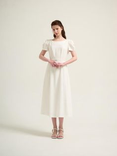 This is a feminine and modern dress by THEATRE that is made out of high quality and sturdy material. With distinctive mood of the design and comfortable wear, you can style it for your casual daily outfit.- Short puffy sleeves- Voluminous silhouette of the skirt- Trendy and feminine mood Chic White Dresses With Pleated Sleeves, White Pleated Sleeve Dress For Work, Feminine White Maxi Dress, White Pleated Sleeve Work Dress, Chic White Puff Sleeve Dress For Work, White Modest Midi Dress For Summer, White Puff Sleeve Dress For Work, Modern White Midi Dress For Formal Occasions, Modern White Midi Dress