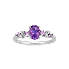 This sterling silver ring features a natural amethyst gemstone at its center for a pretty pop of color. Staggered natural amethyst and diamond accents create a floral look. Purple Pink Sapphire Promise Ring, Purple Pink Sapphire Ring With Center Stone, Fine Jewelry Pink Sapphire Ring In Purple, Purple Birthstone Ring With Gemstone Accents, Purple Diamond Ring With Gemstone Accents, Fine Jewelry Purple Diamond Ring With Gemstone Accents, Fine Jewelry Purple Amethyst Ring With Gemstone Accents, Purple Gemstone Birthstone Ring, Purple Rings With Gemstone Accents