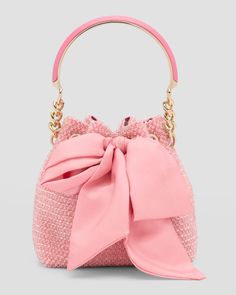 Jimmy Choo "Bon Bon" bucket bag in allover crystals, leather, and nylon     Metal top handle     Detachable, adjustable crossbody strap    Can be worn as a top handle or crossbody bag     Open top with bow ribbon selftie closure     Interior, one card slot     Approx. 6.9"H x 6.7"W x 4.3"D    Item Weight (Lbs.): 1.3    Made in Italy Crystal Bucket, Pink Purses, Jimmy Choo Bags, Prom Clutch, Top With Bow, Market Ideas, Confident Style, Jimmy Choo Bag, Embroidery Bags