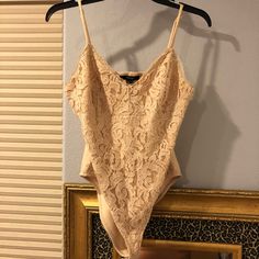 Never Worn Cream Colored Lace Bodysuit! Super Cute Design With Thick Fabric And Adjustable Straps. Great With A Skirt Or High Waisted Jeans, In Perfect Condition! Summer Bodysuit Fitted For Date Night, Summer Date Night Fitted Bodysuit, Spring Fitted Bodysuit For Going Out, Spring Date Night Bodysuit With Lined Body, Forever 21 Fitted Bodysuit, Spring Bodysuit For Night Out With Lined Body, Fitted Bodysuit For Going Out In Summer, Spring Bodysuit For Going Out, Chic Spring Bodysuit By Forever 21