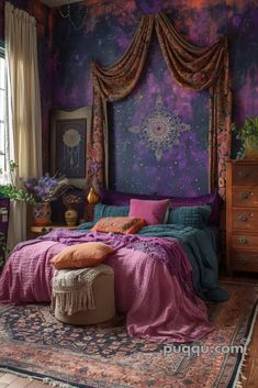 a bedroom decorated in purple and gold with a large bed covered in colorful blankets, pillows and throw pillows