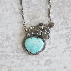 Turquoise with a casted succulent bloom. Sterling silver is patinaed for a weathered + antiqued look. Set in an hand forged bezel with botanical elements. D E T A I L S • Sterling Silver • Chain Length - 18" The necklace will be carefully wrapped in tissue and placed in a decorative kraft box. It's ready to give to that special person! Nature-inspired Nickel Free Turquoise Jewelry, Nickel-free Turquoise Jewelry, Nature-inspired Nickel-free Turquoise Jewelry, Rustic Turquoise Jewelry With Patina, Vintage Silver Turquoise Necklace With Patina, Vintage Sterling Silver Turquoise Necklace With Patina, Vintage Sterling Silver Necklace With Patina, Rustic Silver Jewelry With Patina, Antique Turquoise Jewelry With Patina