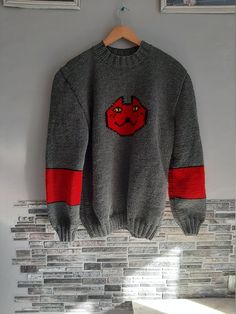 "This listing is for a handmade video game inspired sweater. It is crafted of high quality wool 49% , acrylic 51% blend. Chest Measurements for women Size S - 34- 36\" Size M - 36-38\" Size L - 39-40\" Size XL- 41-42\" Size XXL- 43-44\" If you want it oversize, please, state this in personification section. We will add 3\" for oversize fitting. For custom orders the processing time is 3-4 weeks. Please, feel free to ask any questions as for the custom orders! Thank you for visiting my shop!" Hand Knitted Cotton Crew Neck Sweater, Casual Handmade Cotton Sweater, Casual Handmade Crew Neck Sweater, Handmade Cotton Sweater For Winter, Handmade Cotton Crew Neck Sweater, Handmade Acrylic Sweater For Winter, Casual Hand Knitted Gray Sweater, Handmade Casual Winter Sweater, Handmade Cotton Winter Sweater