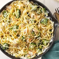 a skillet filled with pasta and broccoli