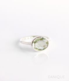 Experience the enchanting light green hue of this Green Amethyst Quartz ring. The perfectly sized oval gemstone adds a touch of elegance to any jewelry collection. A popular choice for February birthdays and Amethyst enthusiasts, this ring features a flawless, transparent green gemstone that is beautifully faceted and bezel-set. Available in either 925 sterling silver or 18k vermeil gold, this exquisite piece makes an ideal birthday gift or a special treat for anyone who appreciates the delicate beauty of Green Amethyst. Gemstone is approximately 8 x 12mm. Band has 925 stamp on inside. Please note that each ring is handmade and there may be some slight variations from listing photo. Available in: ✦ 18K VERMEIL GOLD. ✦ ROSE GOLD.  ✦ BRIGHT STERLING SILVER.  We have these rings available in Classic Green Amethyst Ring As Gift, Classic Green Amethyst Ring Gift, Classic Green Amethyst Ring For Gift, Oval Green Amethyst Ring Gift, Oval Green Amethyst Ring For Anniversary, Green Oval Amethyst Ring For Wedding, Green Amethyst Ring With Oval Shape For Weddings, Oval Green Amethyst Ring, Green Amethyst Ring Gift