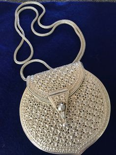 Beautiful little sterling silver purse with a 42" long silver chain. The actual maker is Boutique Kardasti , the research I did said it was a 1930s but to be honest I'm not sure of the date, I've had this purse tucked away for about 20 years. I cleaned it with some Tarn-x and it looks so pretty, I don't know if the pictures do it any justice. Thank you for shopping with me at TahoeGoodies! Elegant Silver Openable Jewelry, Elegant Openable Silver Jewelry, Luxury Silver Necklace For Ceremonial Occasions, Silver Openable Jewelry For Formal Occasions, Silver Necklace With Intricate Design For Evening, Antique Silver Openable Jewelry, Silver Engraved Necklace For Party, Luxury Silver Coin Necklaces, Classic Silver Necklaces For Ceremonial Occasions