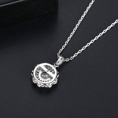 silver-plated pendant necklace with sparkling cubic zirconia and crystals. Chain : 15.75" L with 1.96" extender Pendant : 0.43" W x 0.67" H Lobster claw clasp Silver-plated copper / cubic zirconia / crystal Flower Pendant Necklace, Flower Pendant, Cubic Zirconia, Silver Plate, Silver Tone, Sparkle, Pendant Necklace, Chain, Crystals