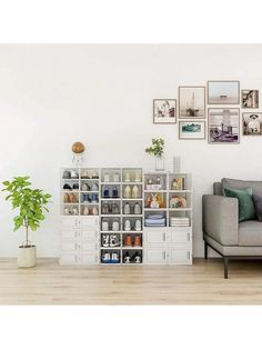 a living room filled with furniture and lots of pictures on the wall above it's bookshelf