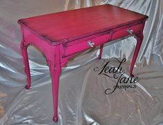 a pink desk with two drawers on it