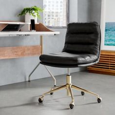 a black office chair sitting in front of a desk