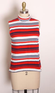 1970s Red, White and Blue Striped Sleeveless Blouse by Sears  This blouse features: *Red, white and blue colors *Striped pattern *Turtleneck *Rear nylon zipper  Label: Sears  Size: Small  Measurements: Bust: 34" Waist: 32" Length: 21" Condition: Excellent If you have any questions, please ask! Find even more Vintage Smalls at: https://www.etsy.com/shop/NaughtyKittyVintage?section_id=17610195&ref=shopsection_leftnav_7 Thanks! -NaughtyKittyVintage Retro Red Sleeveless Tank Top, Vintage Red Sleeveless Top, Skirt Two Piece Outfit, Pattern Turtleneck, Black Leather Pencil Skirt, Striped Sleeveless Top, Formal Cocktail Dress, Gingham Tops, Leather Pencil Skirt