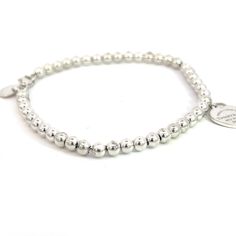 Authentic Tiffany & Co Estate Ball Bracelet 7" Silver 4 mm TIF525This elegant Authentic Tiffany & Co bracelet is made of sterling silver and has a weight of 5.5 grams.TRUSTED SELLER SINCE 2002PLEASE SEE OUR HUNDREDS OF POSITIVE FEEDBACKS FROM OUR CLIENTS!!FREE SHIPPING!!DETAILSStyle: Ball BraceletLength: 7 InchesSize: 4 mmWeight: 5.5 GramsMetal: Sterling SilverWe try to present our Tiffany estate items as best as possible and most have been newly polished some of the Tiffany items may have a nat Elegant Bracelet Tiffany & Co., Tiffany & Co. Bracelet, Sterling Silver Bracelets Women Tiffany & Co., Elegant Silver Name Bracelet With Round Beads, Classic White Gold Charm Bracelet With Silver Clasp, Classic White Gold Charm Bracelet With Sterling Silver Clasp, Classic Charm Bracelet With Sterling Silver Clasp, Silver Jubilee Stretch Bracelet As Gift, Elegant Hypoallergenic Name Bracelet With Round Beads