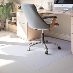 an office chair sitting in front of a computer desk