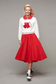 a woman wearing a red skirt and white shirt