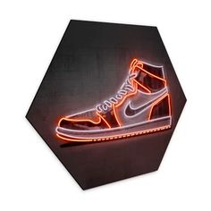 a pair of nike sneakers is lit up with neon lights in the shape of a hexagon