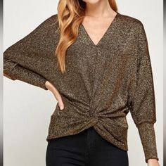 V-Neck Lurex Twist Top Long Cuffed Dolman Sleeve Front Hem With Twist Detail Lining: 52% Lurex, 43% Polyester, 5% Spandex Gold V-neck Top For Fall, Gold Tops For Night Out In Fall, Gold Tops For Fall Night Out, Trendy Gold V-neck Top, Trendy Gold Tops For Fall, Chic V-neck Top For Fall Party, Chic Fall V-neck Top For Parties, Gold Stretch Blouse For Fall, Gold V-neck Blouse For Fall