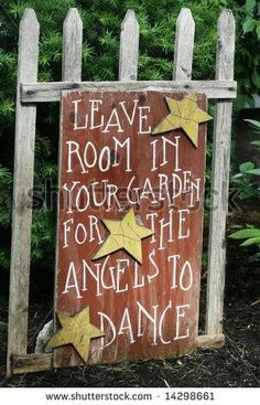 a wooden sign that says leave room in your garden for the angels to dance