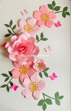 paper flowers and butterflies on a white background