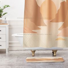 a bathroom with a bathtub, rug and shower curtain in the shape of a woman's head