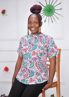 Purple Ankara African Print Top Blouse With Buttons, African Women Wears, Summer Blouse Top, African Tunic Top, African Shirt, Short Sleeve This beautifully crafted classy, easy-to-wear ankara top is made with 100% cotton African wax print floral fabric.  Features: - 100% Handmade - Short sleeve -Button  Buyers can request customization if the measurement is different from the standard.  Production takes 3-5 business days and delivery takes 3-5 business days in most countries. Standard Size Measurements are as follows: Size chart UK 4, US 0 Bust: 30 Waist: 22.5 Hip: 32.5 UK 6, US 2 Bust: 33 Waist: 25.5 Hip: 35 UK 8, US 4 Bust: 34 Waist: 26.5 Hip: 36 UK 10, US 6 Bust: 36 Waist: 28.5 Hip: 38 UK 12, US 8 Bust: 38 Waist: 30.5 Hip: 40 UK 14, US 10 Bust: 40 Waist: 32.5 Hip: 42 UK 16, US 12 Bust: Traditional Short Sleeve Printed Blouse, Traditional Multicolor Short Sleeve Tops, Fitted Multicolor Crew Neck Blouse, Multicolor Fitted Crew Neck Blouse, Traditional Green Short Sleeve Tops, African Print Tops Blouses, Purple Ankara, Ankara Tops Blouses, African Print Top