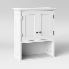 a white cabinet with two doors and drawers