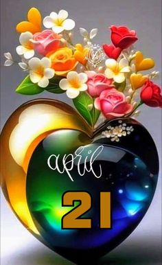 a heart shaped vase with flowers in it and the number 21 on top of it