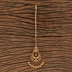 Indian Bridal Traditional One Gram Jewelry Tikka Height = 165 mm || Width = 42 mm Temple Tikka Antique Maang Tikka Whether you are the bride or sassy bridesmaid, no lehenga is complete without a maang tikka. This Kundan pearl maang tikka is perfect to steal the show with its elegance . The meticulous attention paid to the craftsmanship makes it an epitome of jewelry inspiration. 100% Satisfaction Guarantee: Long Lasting Plating, High-Quality Stones. Gifting: This pair of charming maang tikka com Temple Jewelry Tikka For Puja With Intricate Design, Kundan Temple Jewelry Tikka For Rituals, Temple Jewelry Style Tikka As Gift, Navratri Temple Jewelry Tikka With Tilla, Temple Jewelry Style Meenakari Tikka For Rituals, Ceremonial Temple Jewelry Tikka With Latkans, Chandbali Temple Jewelry Tikka For Puja, Navratri Temple Jewelry Tikka With Latkans, Temple Jewelry Tikka For Rituals With Latkans