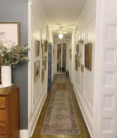 the hallway is clean and ready for guests to use it as an entrance way in this home