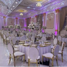 a banquet room set up with tables and chairs