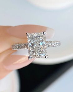 NYK Jewelry 3 CT Radiant Cut Moissanite Ring 14K White Gold Anniversary Ring Radiant Cut Engagement Ring Wedding Ring Anniversary Gift Promise Ring ✦   CENTER  STONE  DETAIL ✦ ✧   Stone : Moissanite ✧   Stone Shape :Radiant  ✧   Stone Size : 7 x 9  mm ✧   Stone Weight : 3  Carat Approx ✧   Stone Color : D ( White ) ✧   Clarity : VVS ✧   Luster : Excellent ✦   SIDE  STONE  DETAIL ✦ ✧   Stone : Moissanite ✧   Stone Shape : Round ✧   Stone Color : D ( White ) ✧   Clarity : VVS ✧   Luster : Excellent ✧  Make : High-Quality Craftsmanship [Other option available on request] ★ Procedure information Please select the material and ring size from the drop-down menu on the right side of the listing. Each ring is handmade just for you in your size and metal. If you have any special requests or questio Wedding Rings Real Diamonds, Rectangle Shaped Engagement Rings, Engagement Rings Rectangular, Engagement Rings Square Cut, Radiant Engagement Ring With Band, Wedding Rings Radiant Cut, Wedding Rings Rectangle, Rectangle Wedding Rings, Dream Engagement Rings Unique