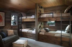 bunk beds in a room with wooden walls