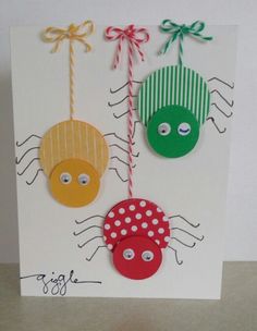 a card with two bugs hanging from it's sides