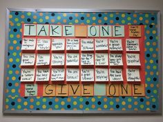 a bulletin board that has been decorated with post it notes and polka dot paper on it