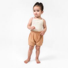 Elevate your child's summer wardrobe with this three pack of baby girl shorts. Made from a lightweight cotton gauze that’s gentle on sensitive skin, these shorts feature a comfort-stretch waistband for an easy fit. These shorts are perfect for those sunny days, ensuring your little one stays cool during outdoor activities and adventures. With a range of colors in this collection, you can effortlessly mix and match various outfits, making them a versatile addition to your child's clothing assortment. And for convenient care throughout the season, just pop them in the washing machine or dryer as needed. Our essentials have been independently certified with STANDARD 100 by OEKO-TEX® so that you don’t have to worry about harmful substances in your baby’s wardrobe. Pack includes three shorts. | Playful Short Bloomers For Summer, Playful Summer Short Bloomers, Short Bloomers For Spring Playwear, Playful Summer Bloomers With Elastic Waistband, Spring Short Bloomers For Playwear, Spring Playwear Short Bloomers, Summer Bottoms With Elastic Waistband For Playtime, Summer Playtime Diaper Cover With Elastic Waistband, Summer Cotton Bloomers For Loungewear