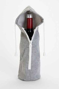 a bottle of wine in a grey hoodie with white zippers on the side