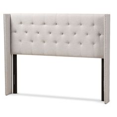 the headboard is upholstered with buttons