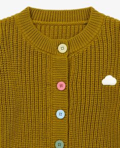 Designed with comfort in mind, this Knit Cardigan in Turmeric will help your little one stay cozy this Fall/Winter. Made from 100% merino wool, a natural and eco-friendly material, this lightweight cardigan is soft, hypoallergenic, and will keep your child warm while they're out on their adventures. This cardigan has a crew neck cut with an adorable cloud motif in the front, a tribute to your little daydreamer. Made with a relaxed fit, this chunky knit cardigan It has textured finish and ribbed Chunky Knit Cardigan, Lightweight Cardigan, Stay Cozy, Knit Beanie, Chunky Knit, Knit Cardigan, Little One, Merino Wool, Men Sweater