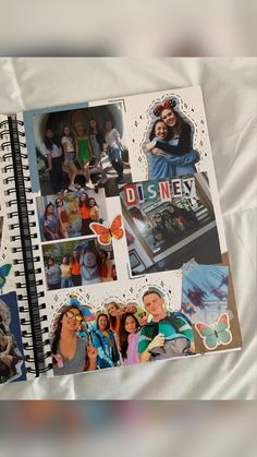 an open notebook with pictures of people on it