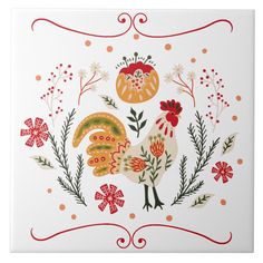 a white tile with colorful flowers and roosters on the front, surrounded by orange dots