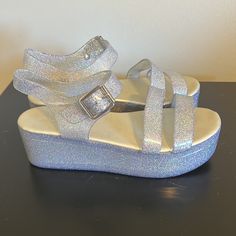 Iridescent/Rainbow Sparkle Jelly Shoes/ Sandals. Made By Aldo, Basically Brand New, Only Worn A Few Times. No Scuffs Or Scratches. Glitter Jelly Sandals With Round Toe For Summer, Glitter Jelly Sandals For Summer, Summer Glitter Jelly Sandals With Round Toe, Summer Synthetic Sandals With Shimmer, Summer Shimmer Synthetic Sandals, Rainbow Round Toe Sandals For Party, Rainbow Sandals With Round Toe For Party, Glitter Round Toe Jelly Sandals For Party, Iridescent Round Toe Synthetic Heels