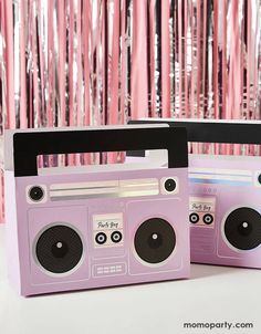 two pink boomboxs sitting next to each other