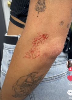 a person with a tattoo on their arm