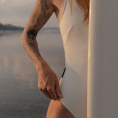 Details Introducing the Boa One Piece - the perfect one piece swimsuit for surfers seeking comfort and style. With its built-in bra, this cleverly designed piece provides exceptional breast support while keeping you fashion-forward. Say goodbye to uncomfortable swimwear and hello to confidence! The Boa One Piece features flattering lines that accentuate your natural curves, making it a timeless and elegant choice for any occasion. Whether you're lounging by the pool or catching waves, this swims Compressive Nylon Swimwear For The Beach, Compressive Beachwear Bodysuit For Beach, Second-skin Beach Swimwear, Compressive Beachwear Bodysuit, White Second-skin Swimwear For The Beach, White Second-skin Swimwear For Summer, White Tight-fitting Swimwear For Summer, Second-skin Swimwear For Beach Season, Sporty Second-skin Swimwear For Swimming