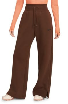 Get incredibly comfy in these wide-leg sweats with split hems so you can show off your favorite footwear. Taller ribbing at the waist, as well as an exaggerated drawcord, ensure the look is anything but basic. 28" inseam; 12" front rise (size Small) 80% cotton, 20% polyester Machine wash, tumble dry Imported Nike Fall Streetwear Joggers, Casual Brown Wide Leg Sweatpants, Leisure Wide Leg Pants For Fall, Nike Sweatpants For Winter Loungewear, Sporty Wide Leg Sweats For Fall, Sporty Wide-leg Sweats For Fall, Nike Solid Sweats For Fall, Nike Solid Color Sweats For Fall, Nike Solid Color Fall Sweats