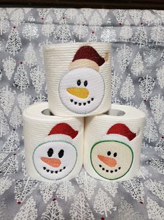 three rolls of toilet paper with snowmen on them